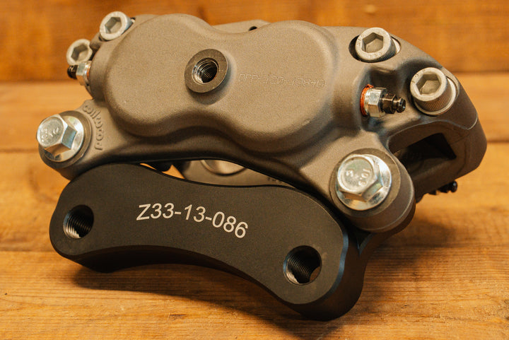 Nissan 350Z Wilwood Front Caliper Bracket back side of the bracket and caliper