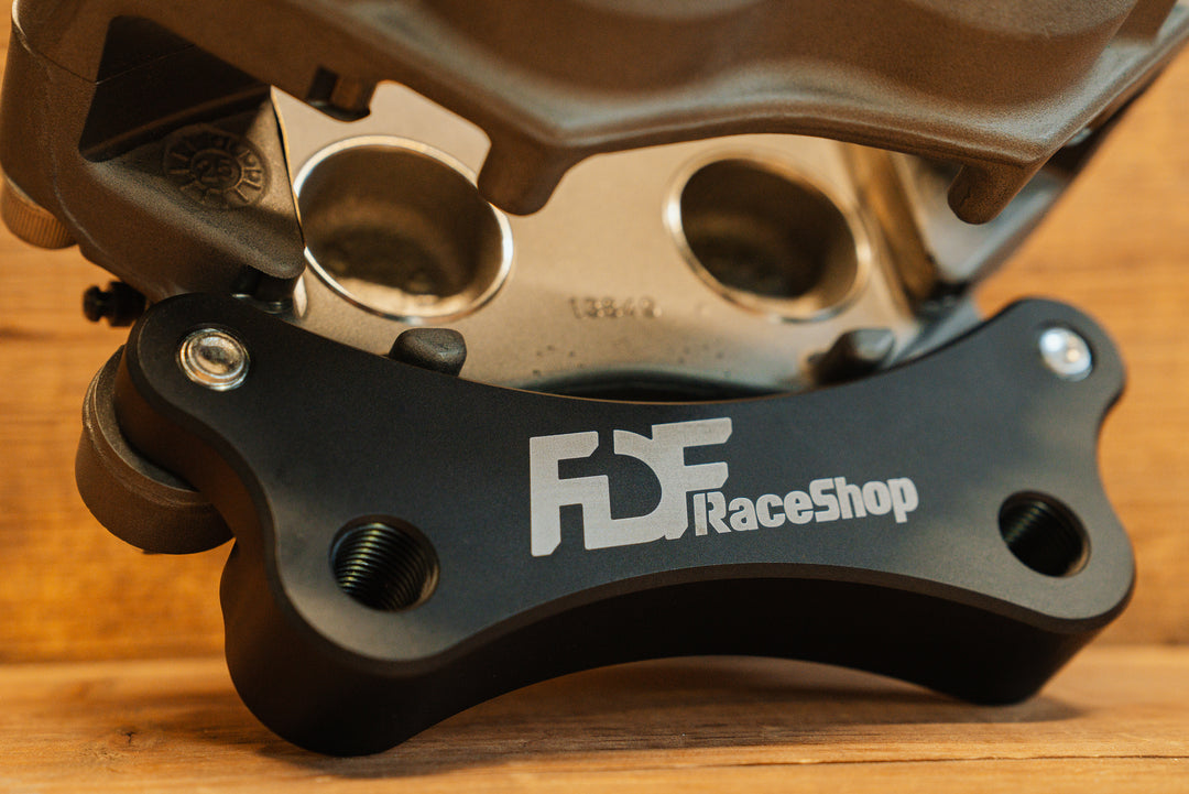 Nissan 350Z Wilwood Front Caliper Bracket close up on caliper