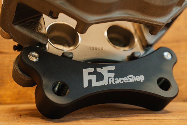 Nissan 350Z Wilwood Front Caliper Bracket close up on caliper