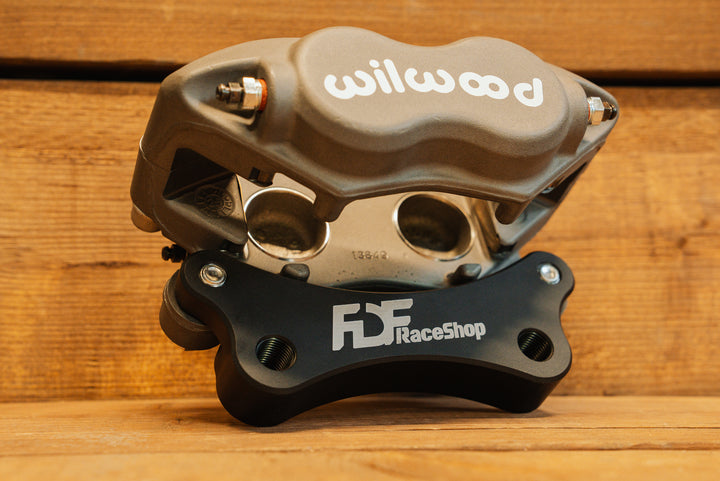 Nissan 350Z Wilwood Front Caliper Bracket attached to caliper angled