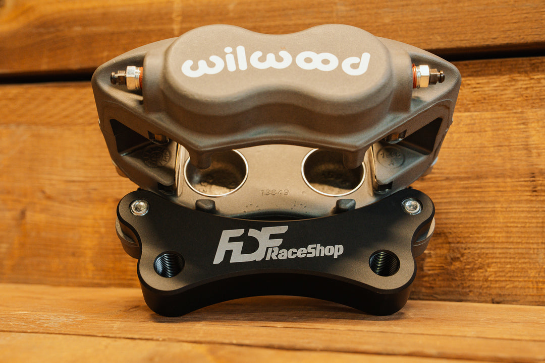 Nissan 350Z Wilwood Front Caliper Bracket attached to caliper
