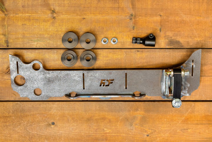 overhead of 350z/g35 rack relocation kit with hardware and bushings