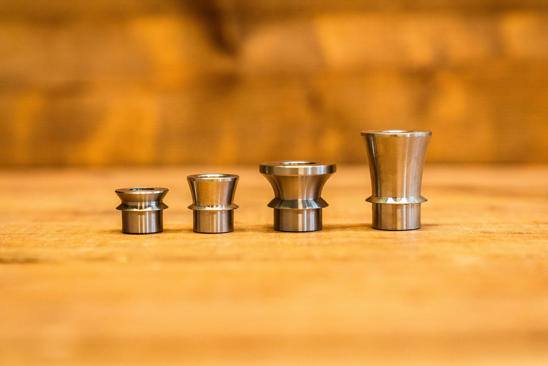 Four stainless steel high misalignment spacers in different sizes, custom heim joint and rod end spacers by FDF Race Shop