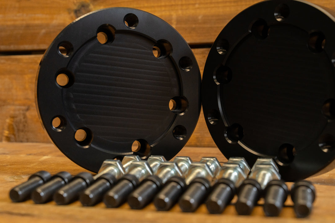 close up of hardware with anodized black quick change axle adaptors